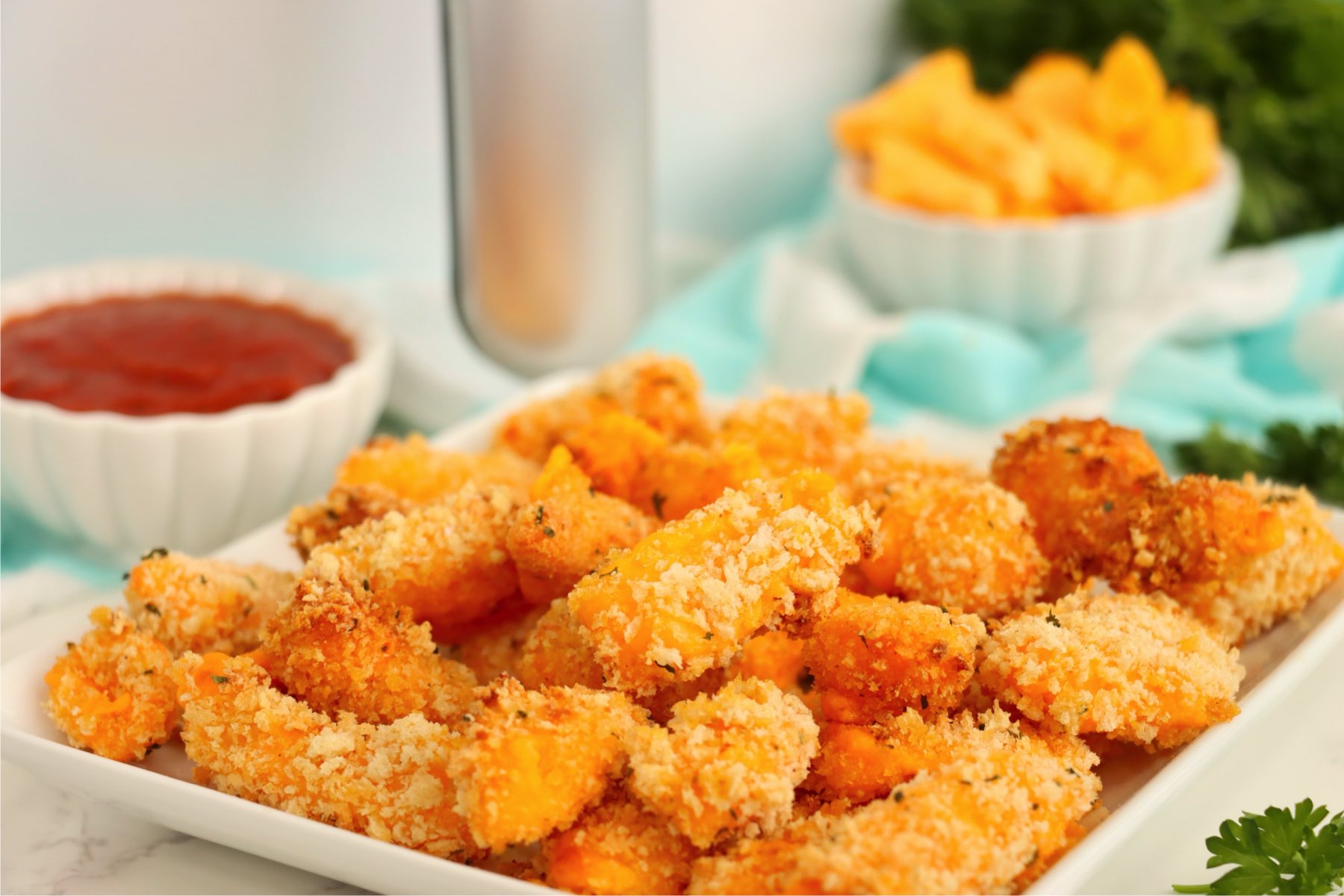 Air fryer cheese curds arranged on a serving platter.