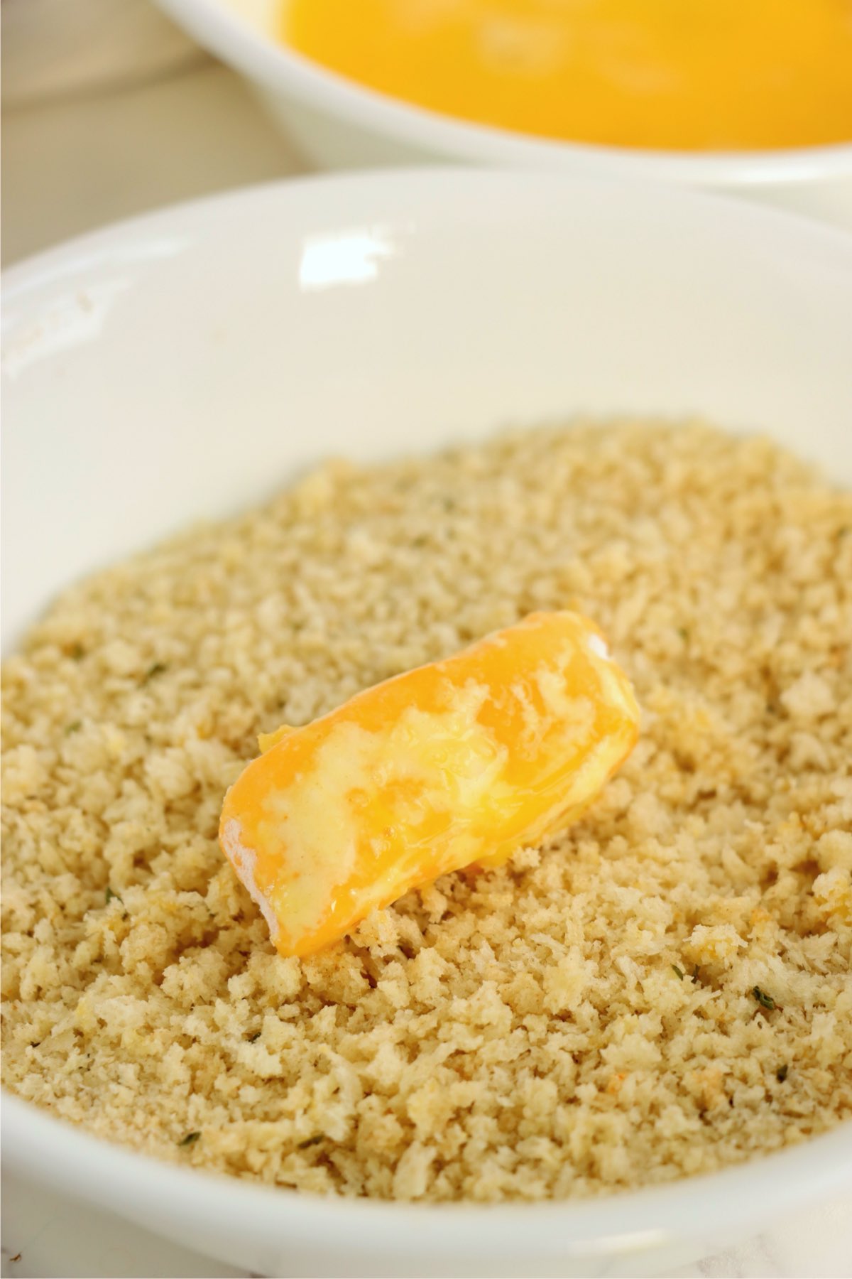 Cheese curd rolled in seasoned panko bread crumbs.
