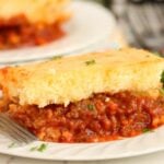 A slice of Sloppy Joe Bake showing the saucy meat layer and golden topping.