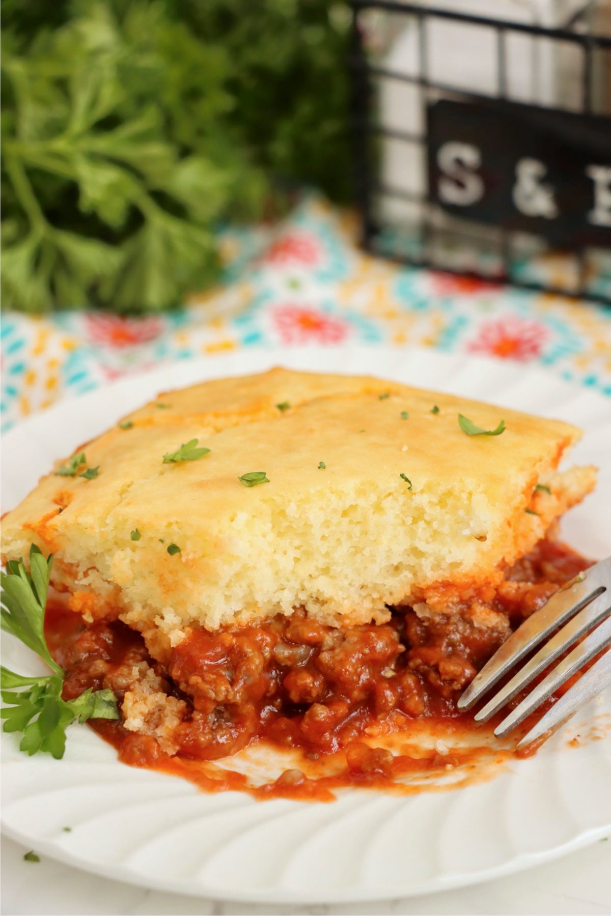 Sloppy Joe Bake slice with biscuit topping and savory meat filling.