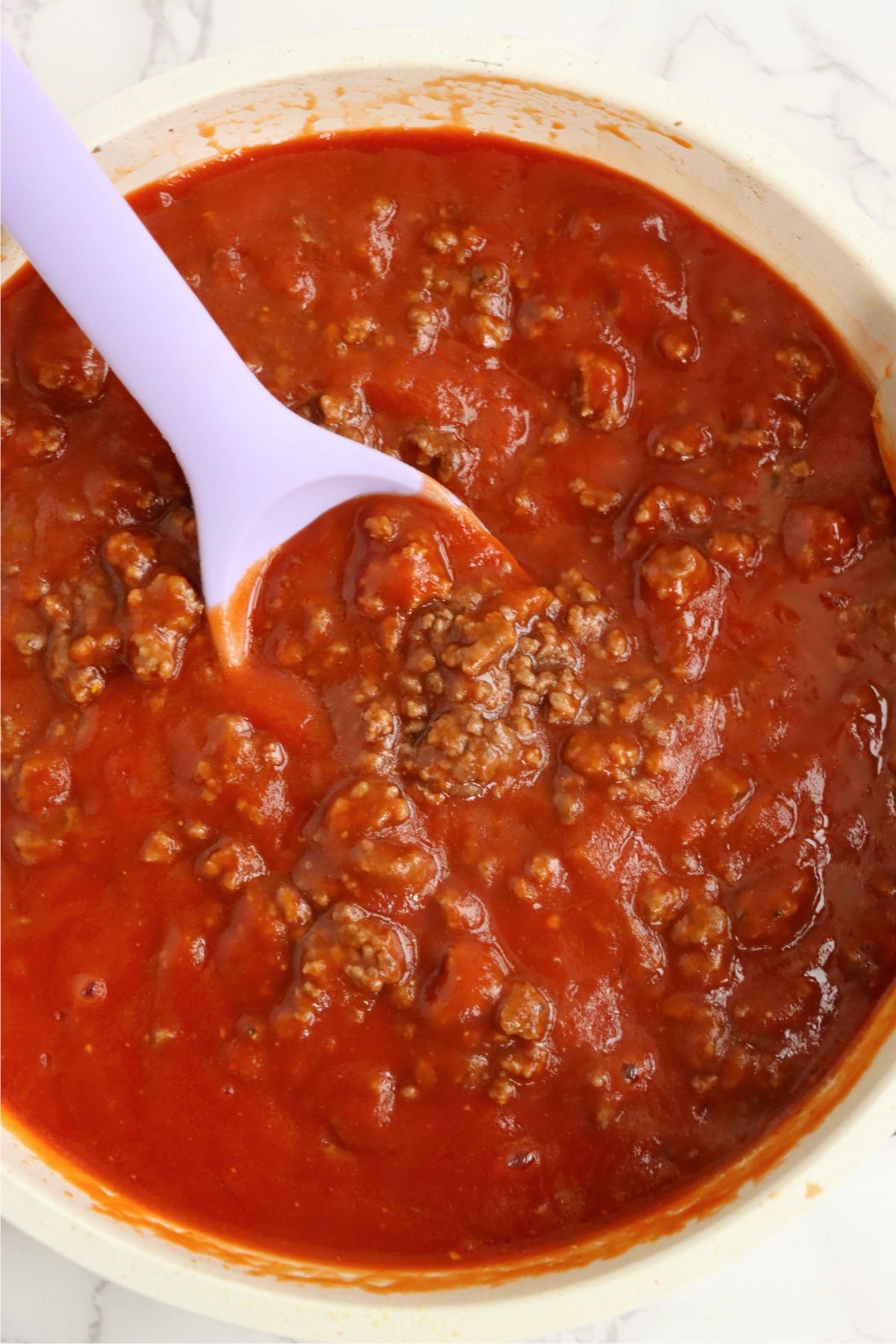 Sloppy Joe meat mixture simmering in a pan.