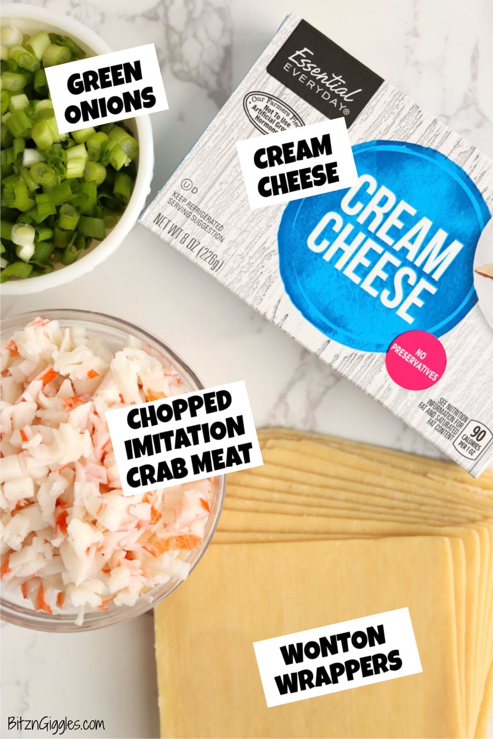 Ingredients for air fryer crab rangoon including cream cheese, green onions, imitation crab meat, and wonton wrappers.