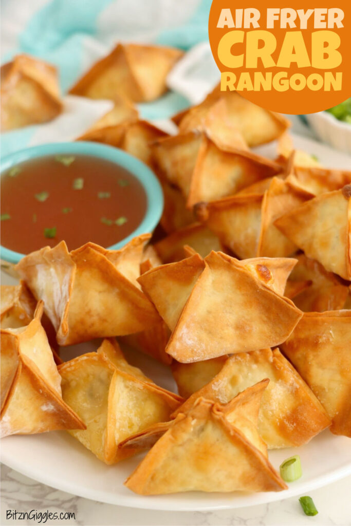 Air fryer crab rangoons served with sweet and sour dipping sauce.