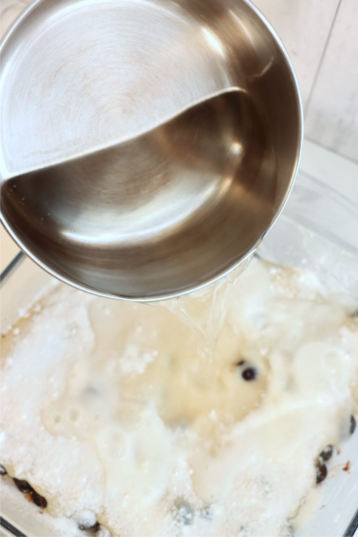 Boiling water poured over the top of the unbaked pudding cake mixture.