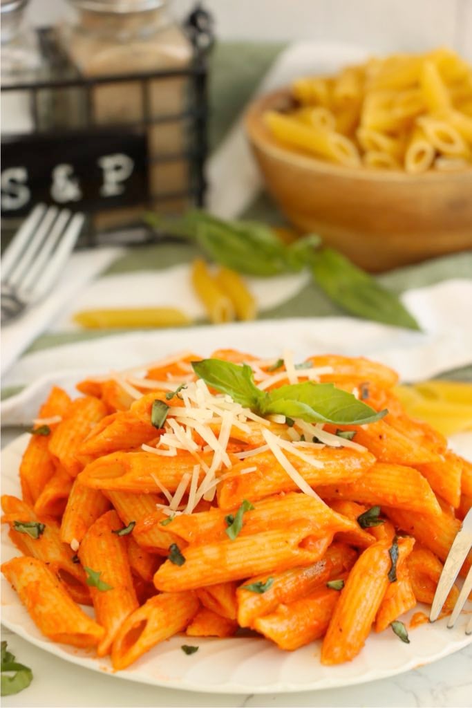 Penne alla vodka topped with freshly grated parmesan cheese.
