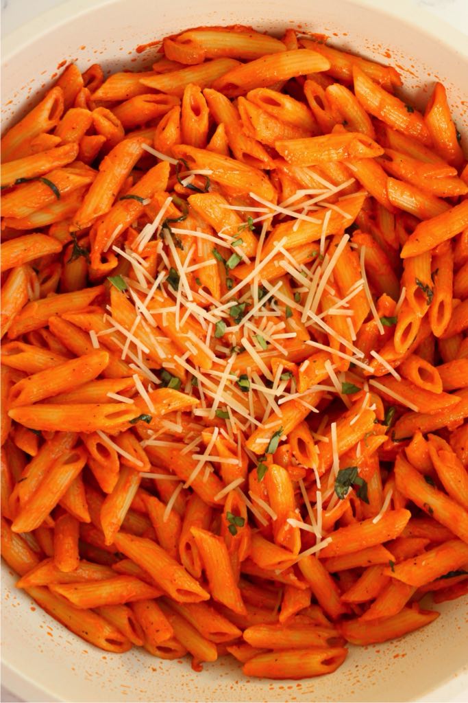 Penne pasta fully coated in creamy tomato vodka sauce.