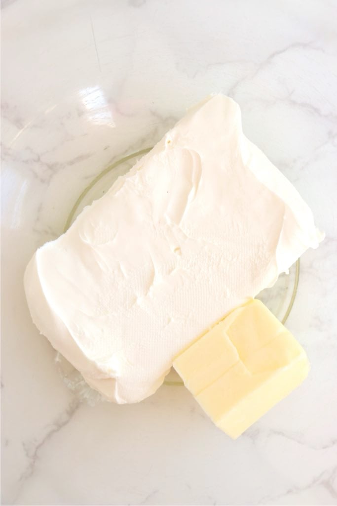 Cream cheese and butter placed in a bowl ready to be mixed for frosting.