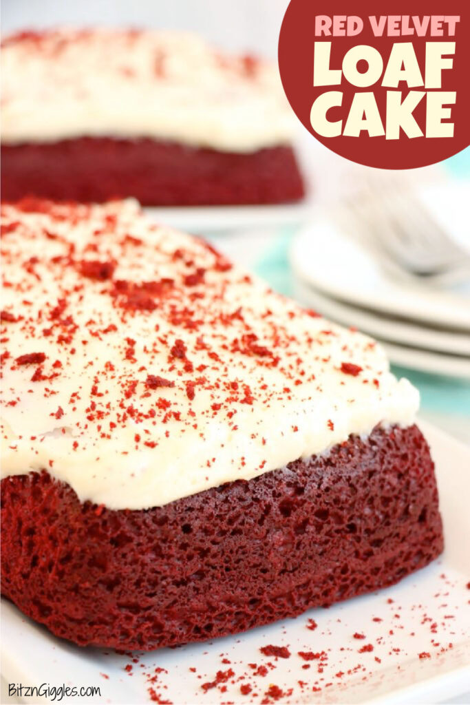 Red velvet loaf cake topped with cream cheese frosting and crumbs
