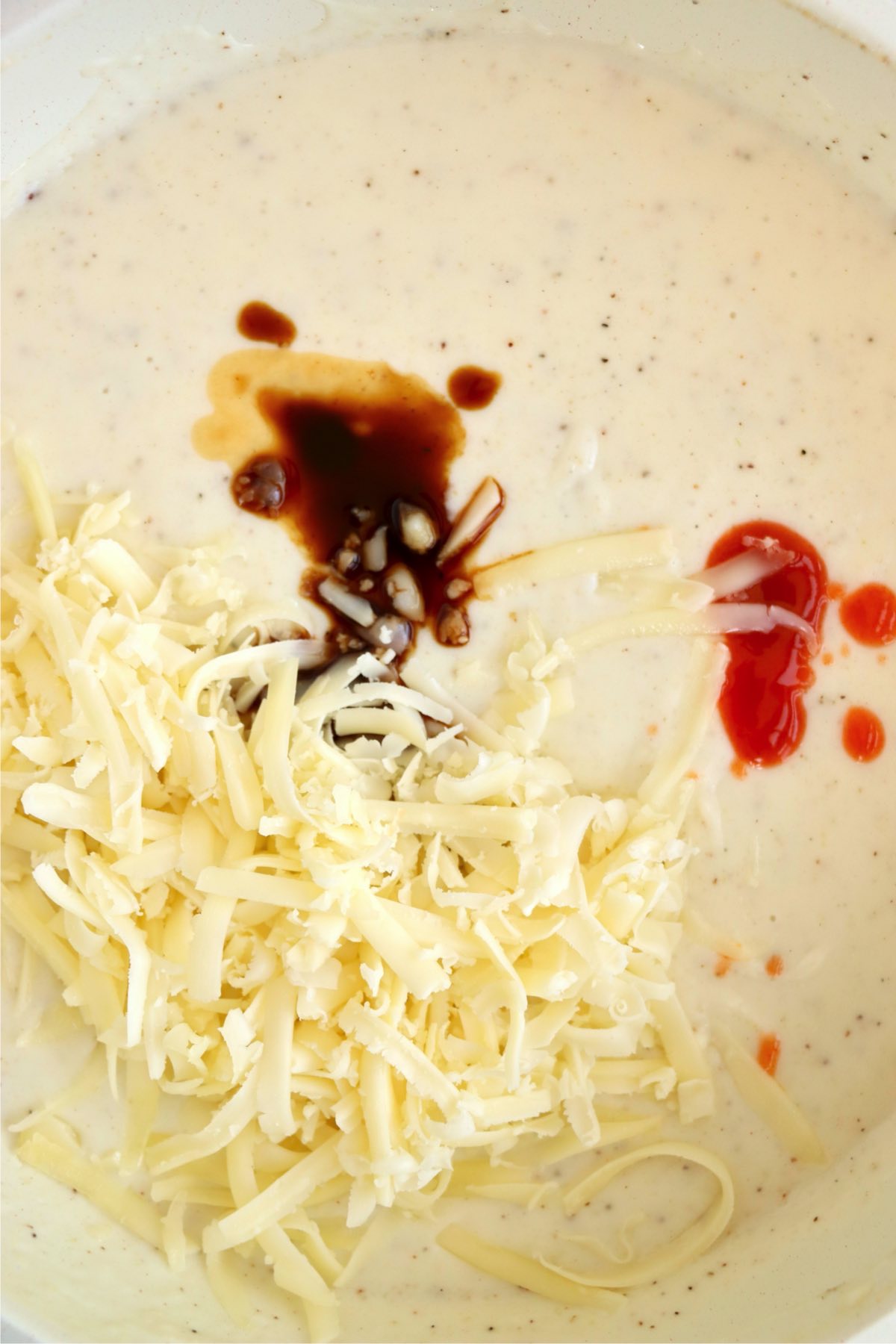 Gruyere cheese, Worcestershire sauce, and hot sauce added to a creamy seafood sauce.