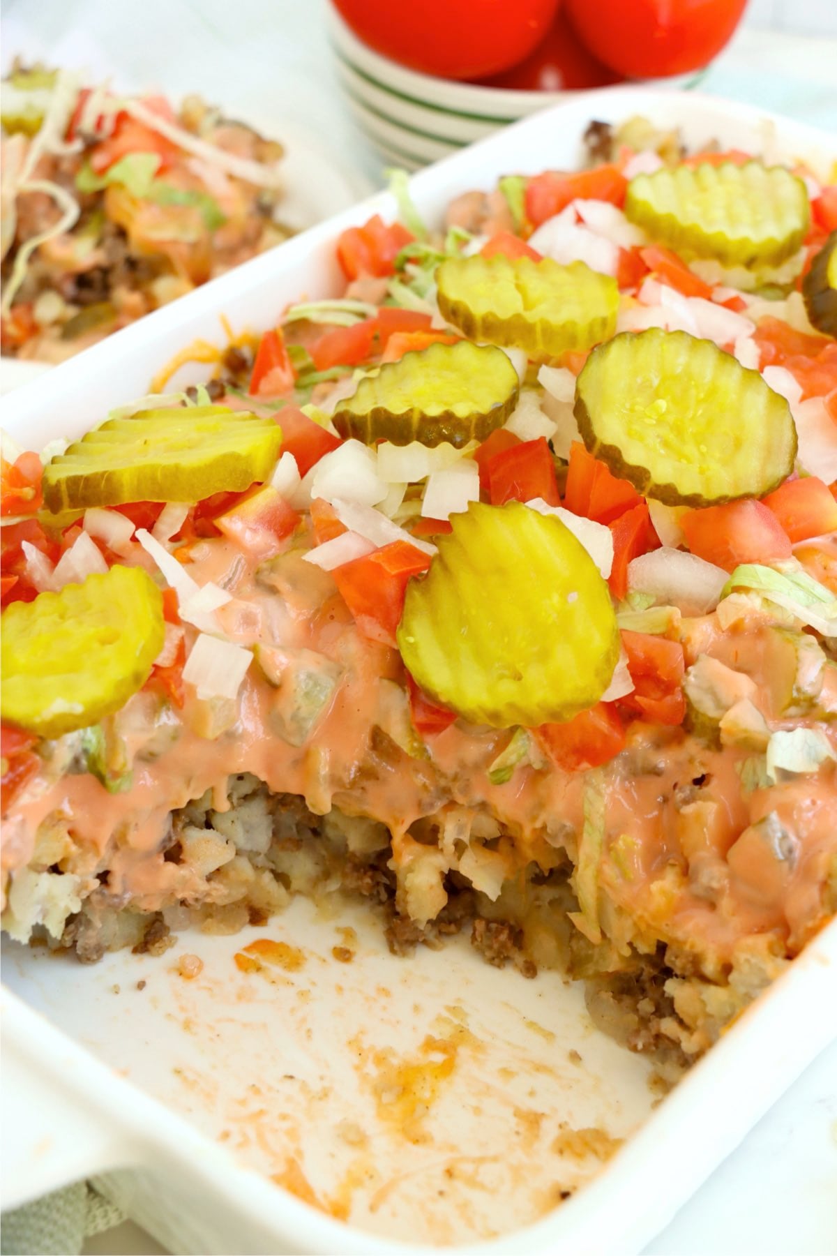 Partially served casserole in baking dish with visible layers.