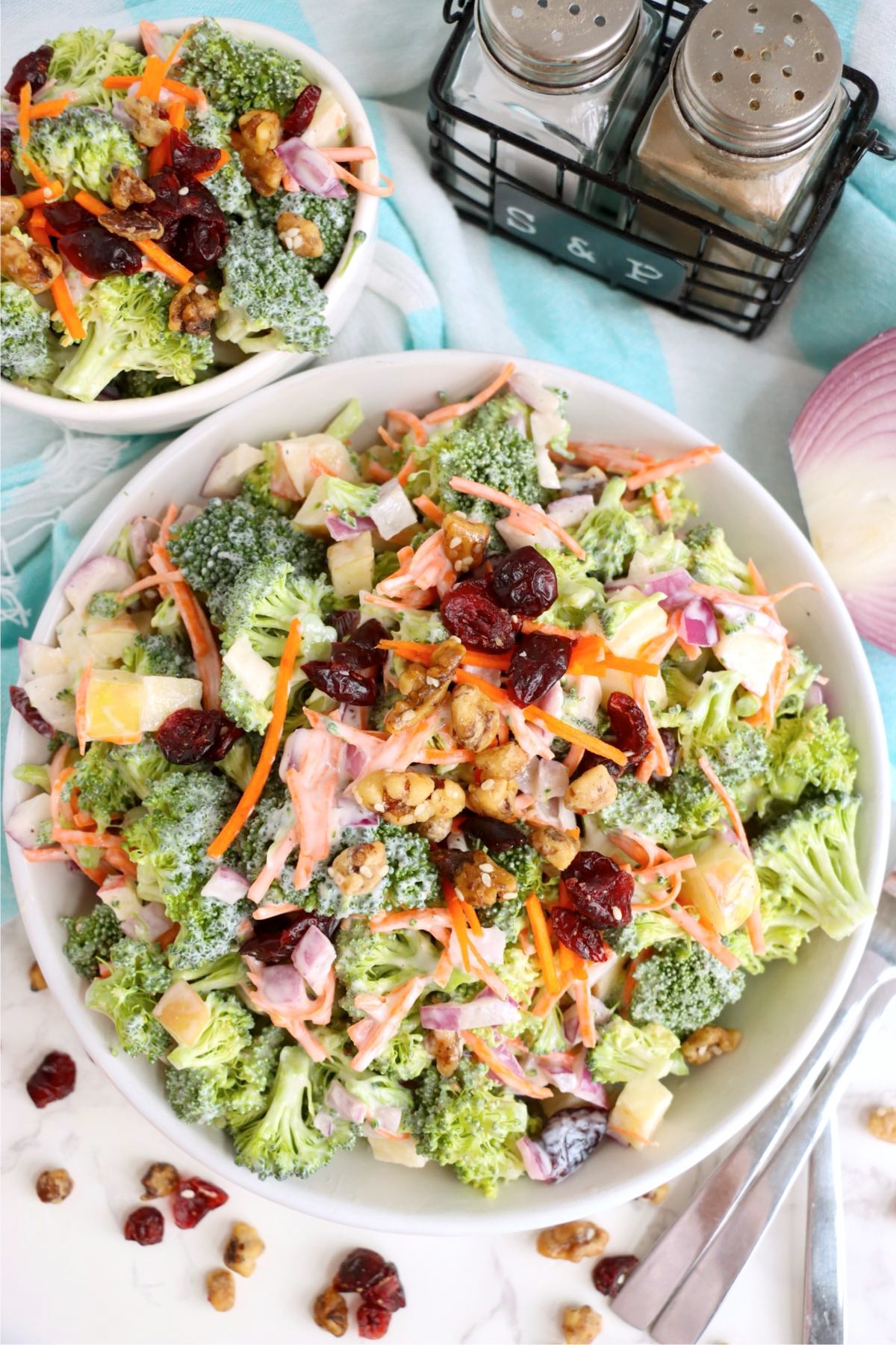 Broccoli salad with apples, carrots, red onion, and creamy dressing.
