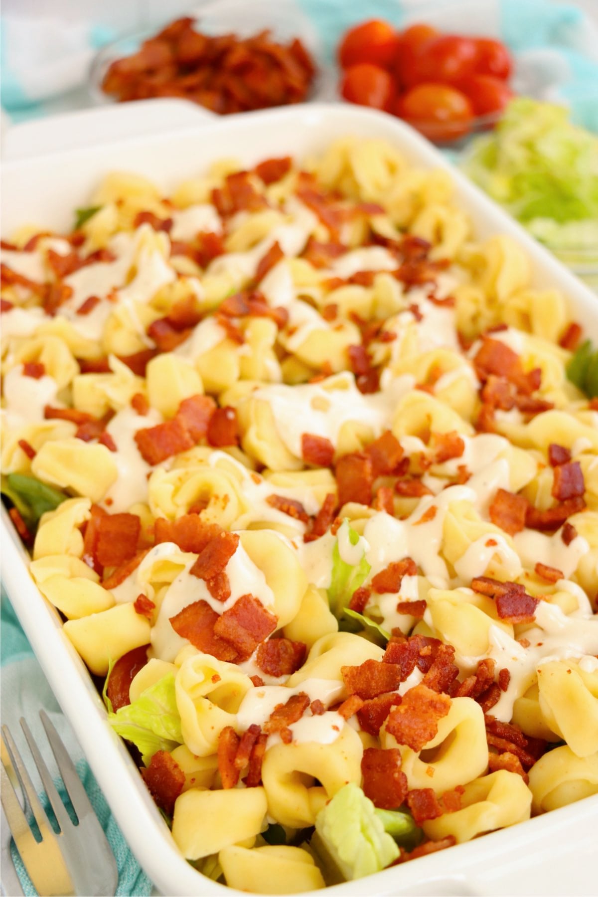 Creamy tortellini salad with ranch dressing, crispy bacon, lettuce, and grape tomatoes.