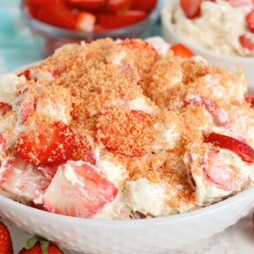 Strawberry Cheesecake Fluff recipe with creamy cheesecake filling, strawberries, marshmallows, and crunchy topping.