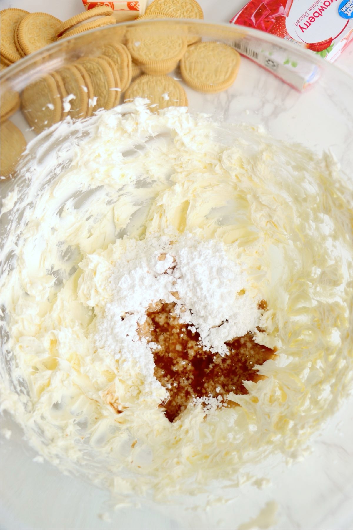 Cream cheese beaten smooth with powdered sugar and vanilla in a large mixing bowl.