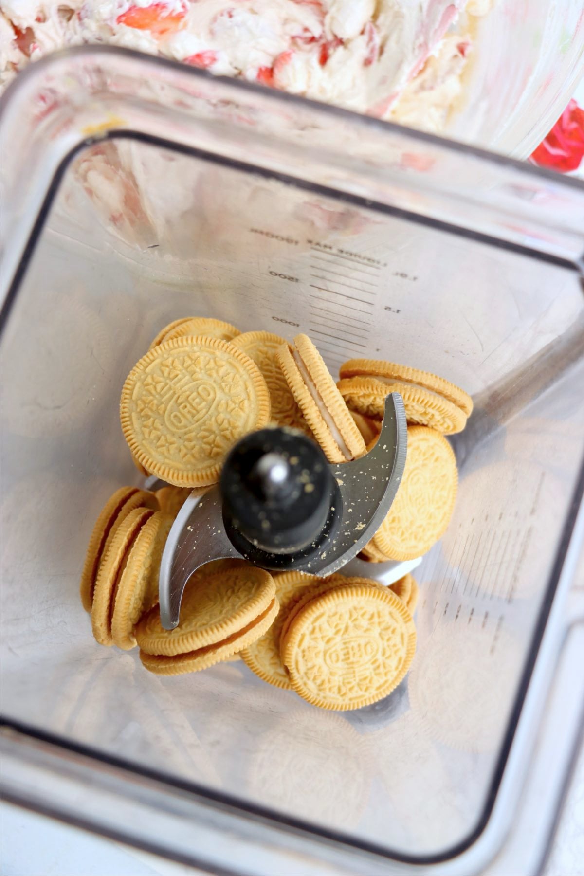 Golden Oreos crushed and mixed with melted butter and strawberry gelatin powder for crunchy topping.