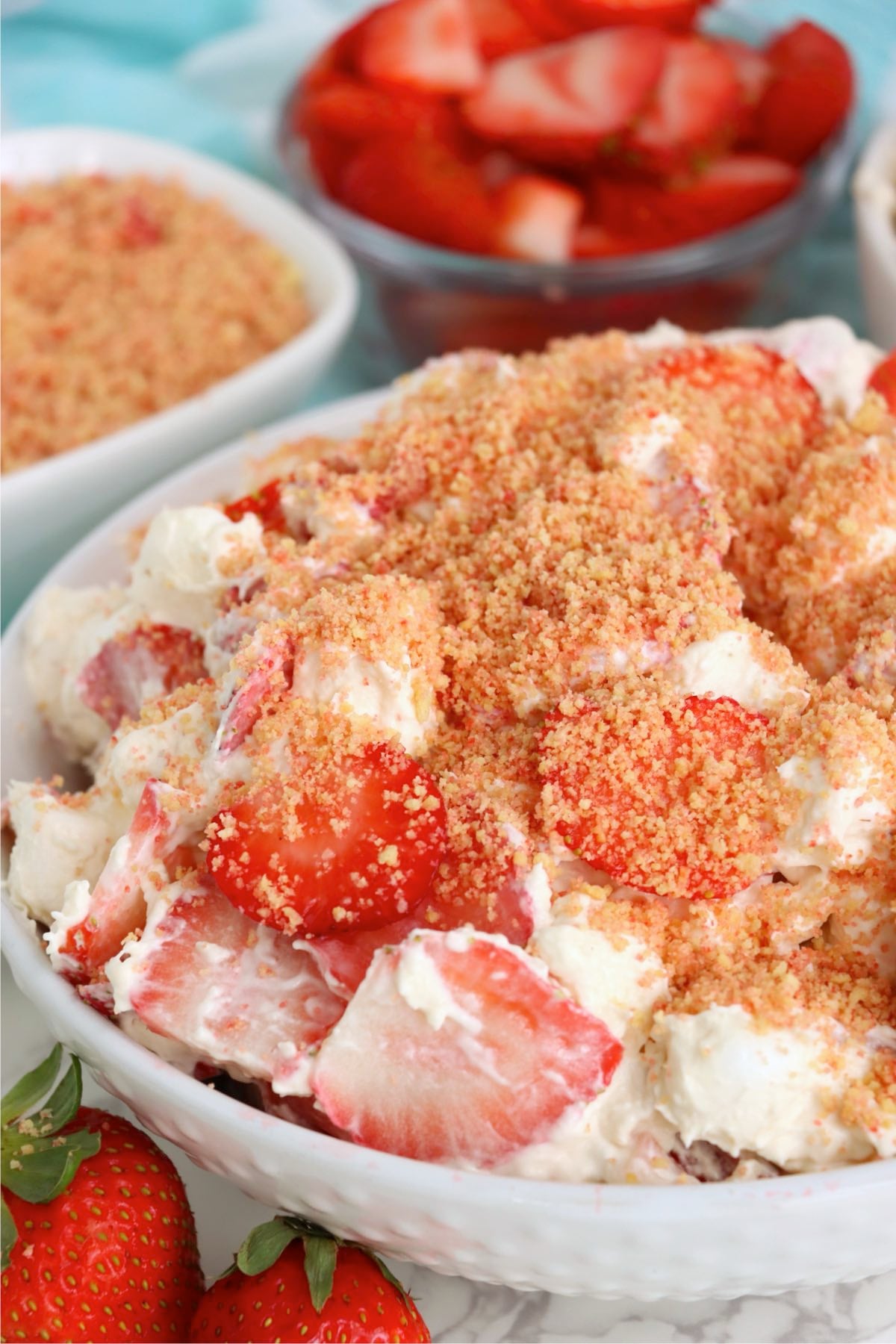 Strawberry cheesecake fluff topped with Golden Oreo strawberry crunch and fresh berries.