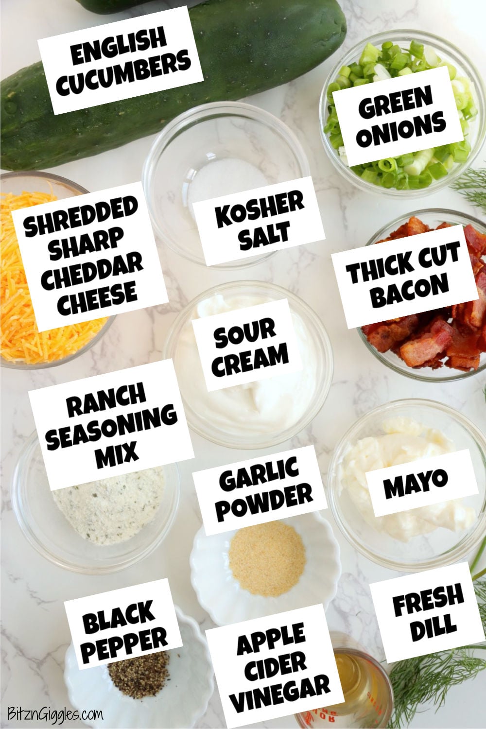 Whole cucumbers surrounded by shredded cheddar, bacon, green onions, fresh dill, creamy ingredients, seasonings and apple cider vinegar.